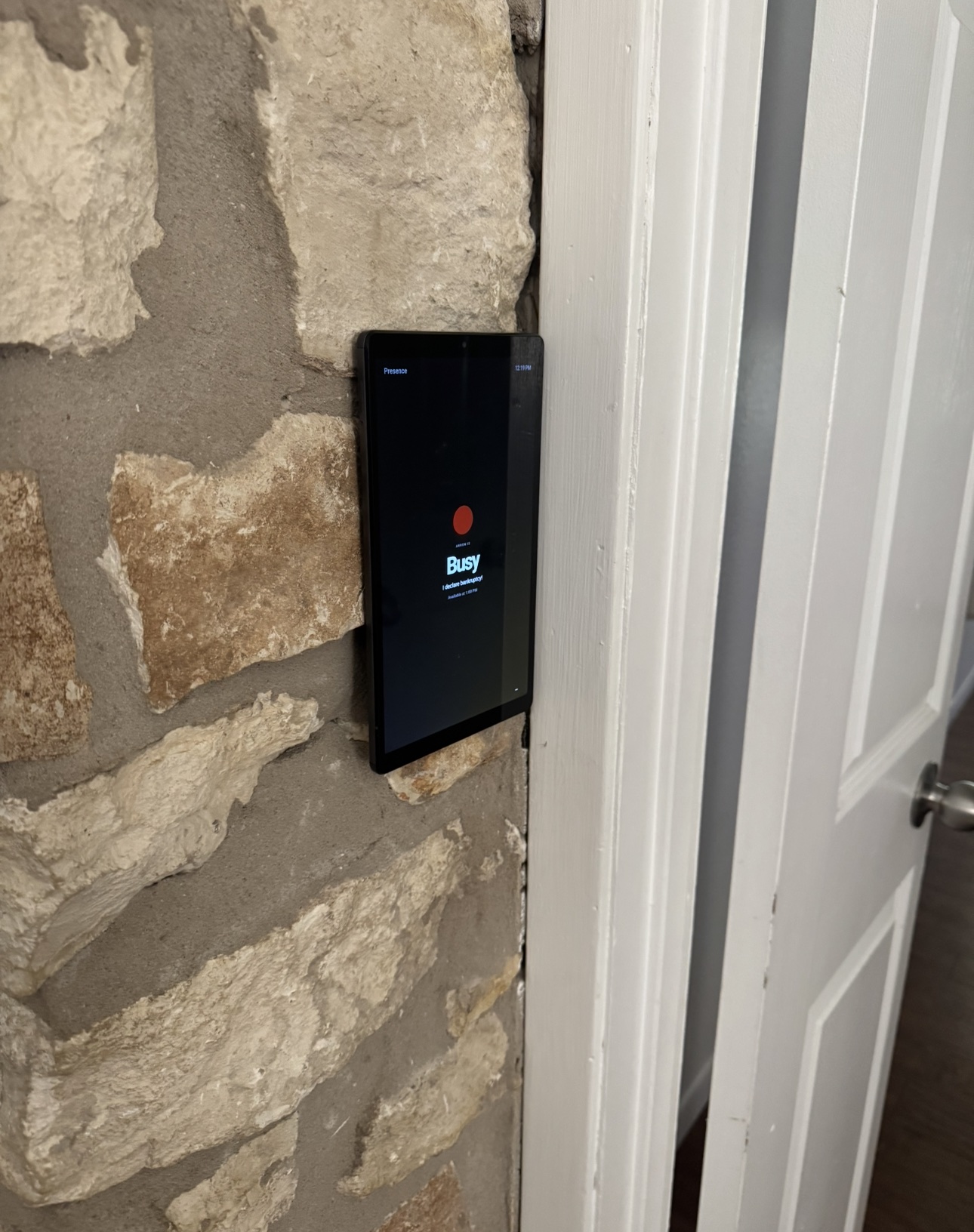 A wider view of the Presence tablet mounted outside Arron's home office